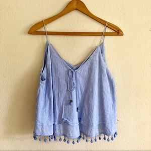 Lavender sleeveless blouse with pom pom details
